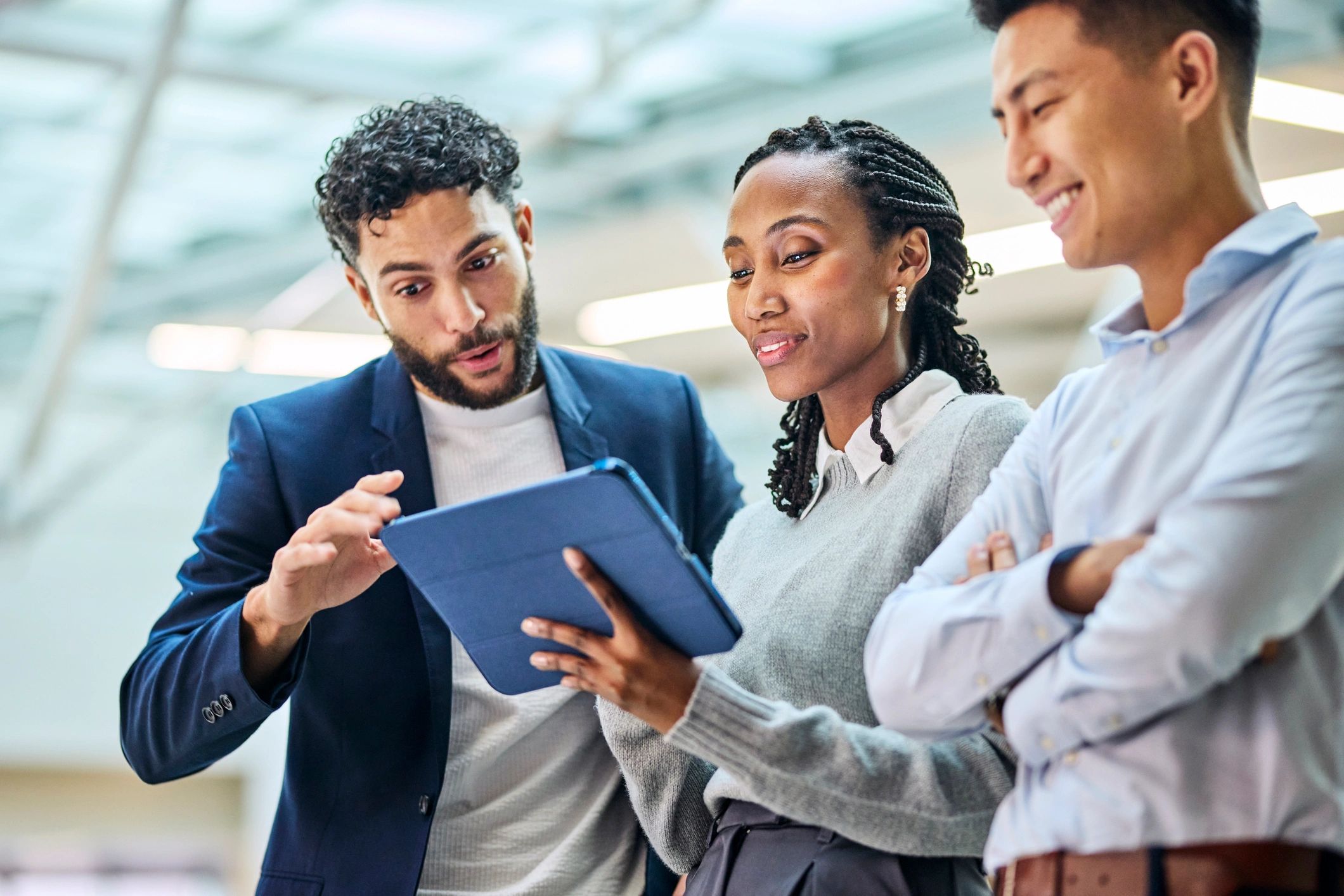 Fintech team collaborating around a tablet